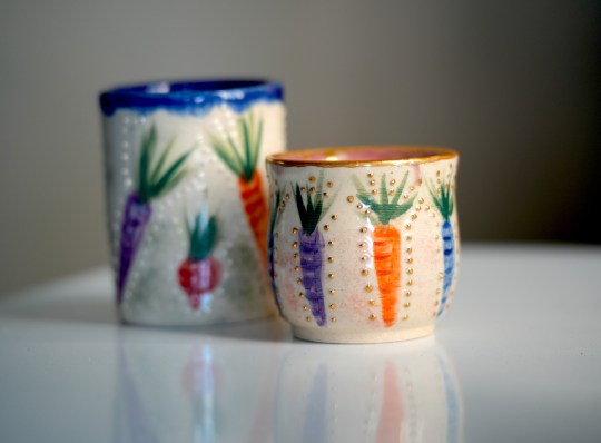 Cups with carrots and radishes painted on them