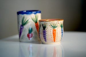 Cups with carrots and radishes painted on them